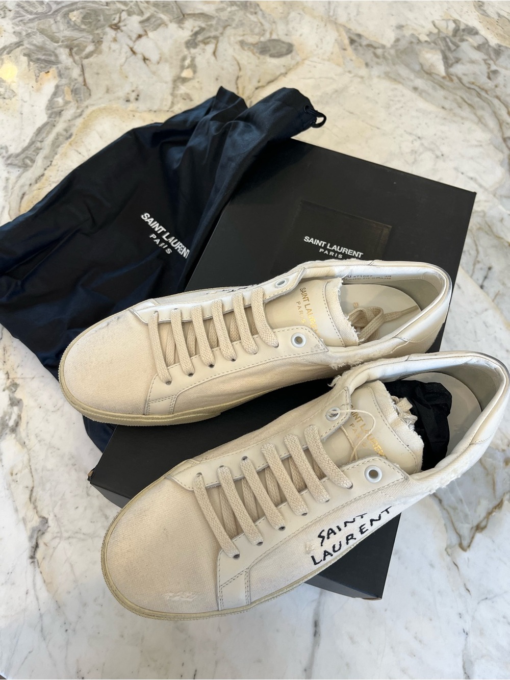 Saint Laurent Men’s distressed embroidered sneakers